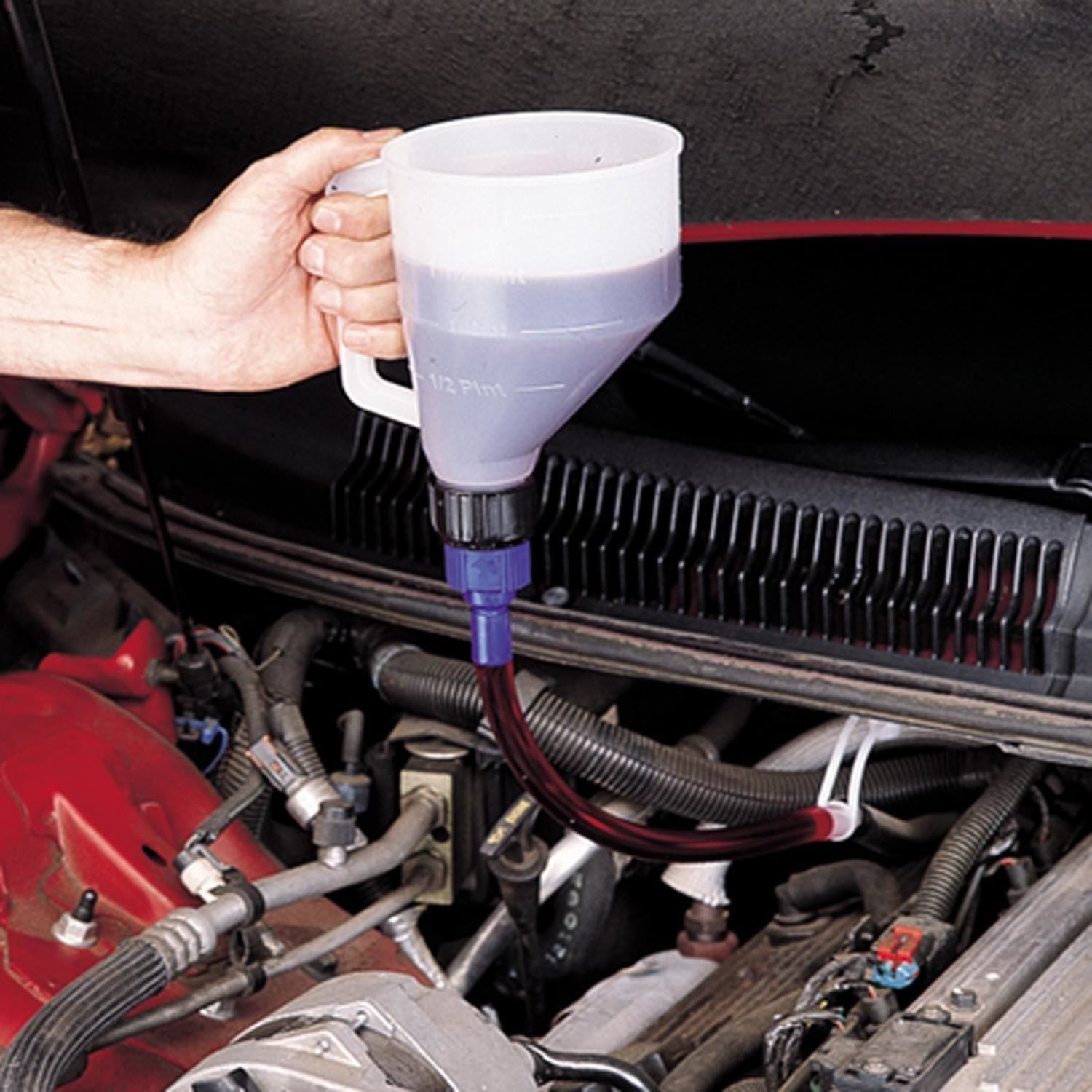 a long tube rather than a funnel to add windshield washer fluid?